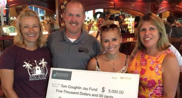Steve Nix presents a check to representatives of the Jay Fund.