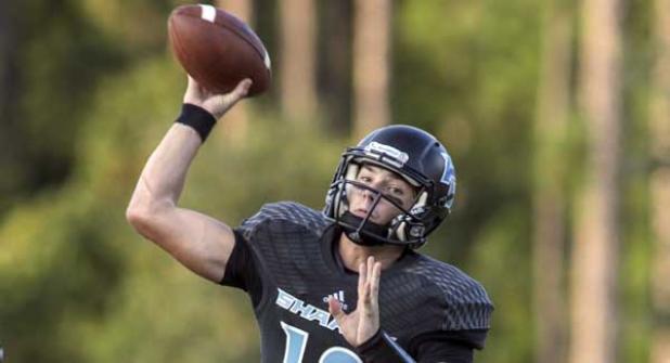Sharks quarterback Nick Tronti fires a pass against  Oakleaf High at The Shark Tank. Tronti  tossed three touchdowns in the Sharks' win. (photo by David Rosenblum)