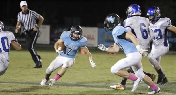 Sharks running back Zach Walton runs for a gain during the game against Menendez. (photo by Scott Montroy)