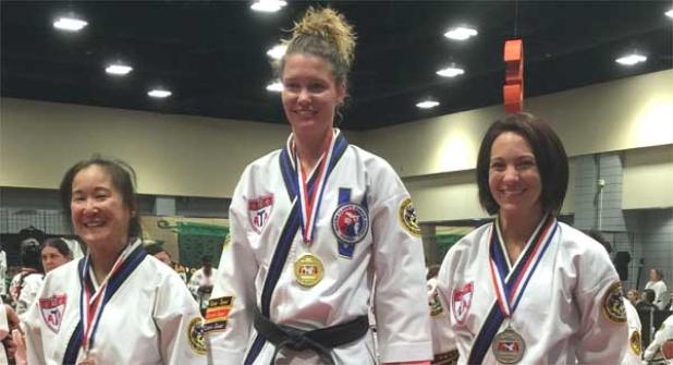 Amber Smith, center, took gold at the American Taekwondo Association World Expo. (photo submitted)