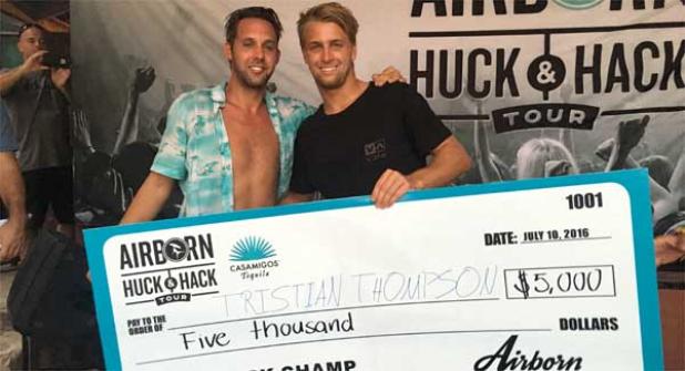 Jeff Crego (left) presents the winner's check to Jacksonville Beach surfer Tristan Thompson. (photo submitted)