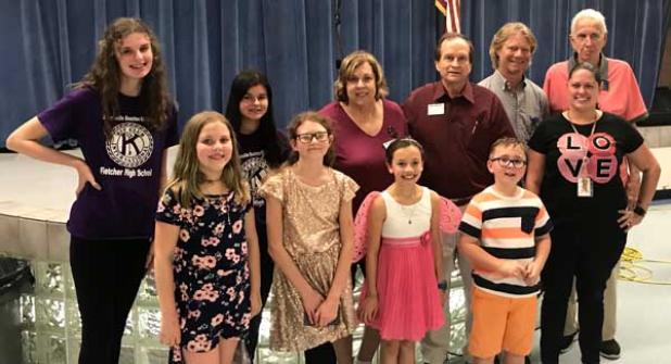 Shown are two Fletcher Kiwanis Key Club Volunteers; Beaches Kiwanians Mary Ann Harper and Bob Burch; Finegan Art Teacher Jonathan Lynn; Beaches Kiwanian Karl Price; Finegan K-Kids Vice President Aubrey Saylor; Finegan K-Kids President Meredith Stocking; Finegan K-Kid London Kelley; Finegan K-Kids Treasurer Aiden Overland; and Finegan Pre-K Teacher Brittany Barbatelli. (photo submitted)