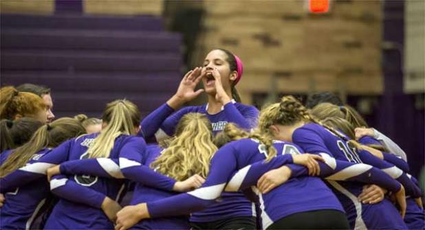 Fletcher volleyball player Brooke Ruud (center) leads on a cheer after Fletcher defeated Trinity Christian last Tuesday. (photo by David Rosenblum)
