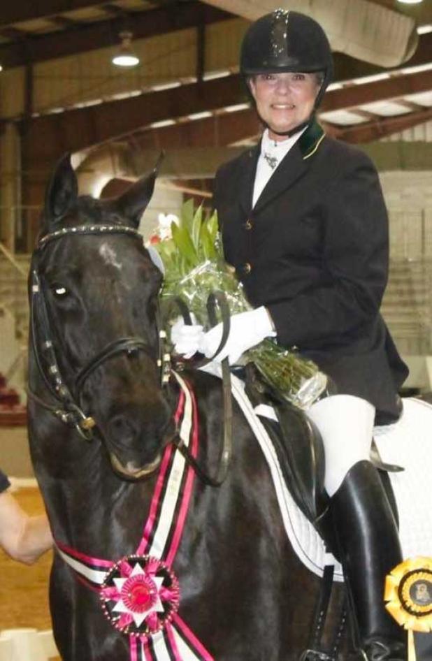 Wanda Wiggins and Dusine are inducted into The Dressage Foundation’s Century Club after their ride at the Jacksonville Equestrian Center. (photo by Maria Croft)