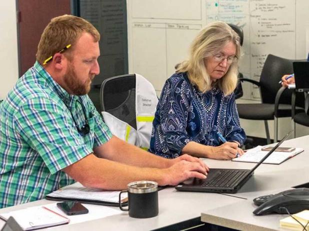 Dave Dickens, director of transportation, facilities and safety services, and District Executive Director Dr. Ann Shortelle guide the district’s preparation for and response to severe storm events and other emergencies. (photo submitted)