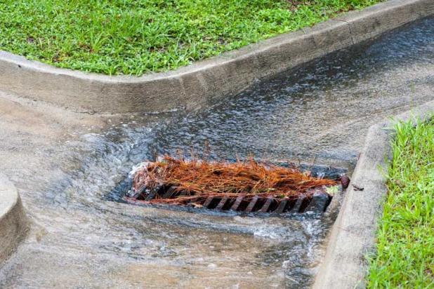 Keeping debris out of storm drains and ditches can help prevent flooding in roadways.