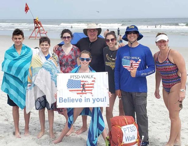 Stephen Meyers with a group on the beach following his PTSD walk. (photo submitted)
