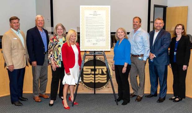 Shown from left are governing board members J. Chris Peterson and Doug Bournique; District Executive Director Dr. Ann Shortelle; board Secretary Susan Dolan; board members Janet Price and Cole Oliver; board Vice Chairman Rob Bradley; and District General Counsel Mary Ellen Winkler. (photo submitted)