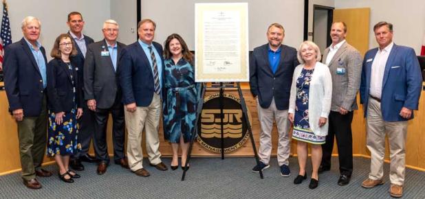 Shown are, from left, governing board member Doug Bournique; district General Counsel Mary Ellen Winkler; board members Ryan Atwood and Douglas Burnett; district Executive Director Mike Register; board Vice Chair Maryam Ghyabi-White; board Chair Rob Bradley; and board members Janet Price, Cole Oliver and J. Chris Peterson. (photo submitted)