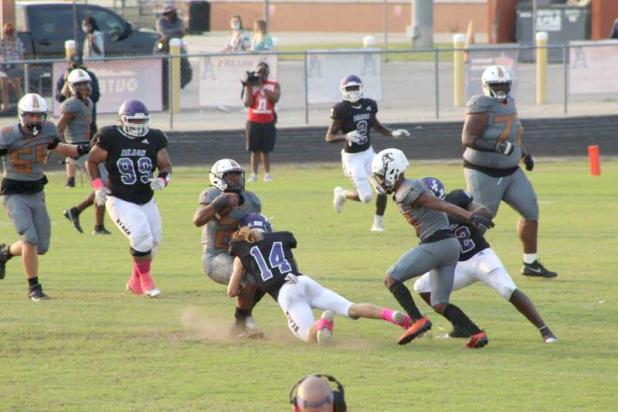 The Senators' Eli Durden makes a tackle during Fletcher High School's game against the Atlantic Coast Stingrays. (photo by Ronda Patterson)